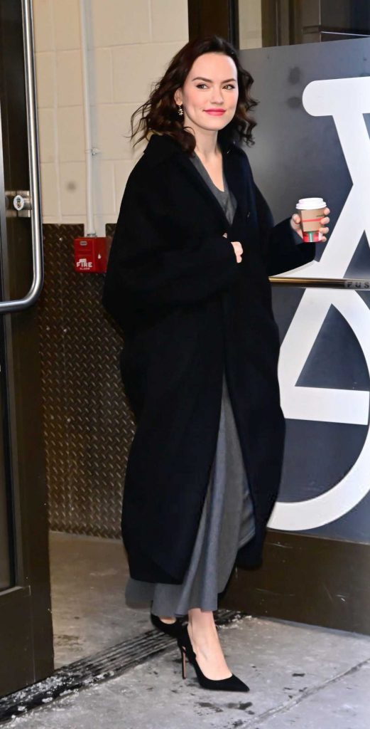 Daisy Ridley in a Black Coat