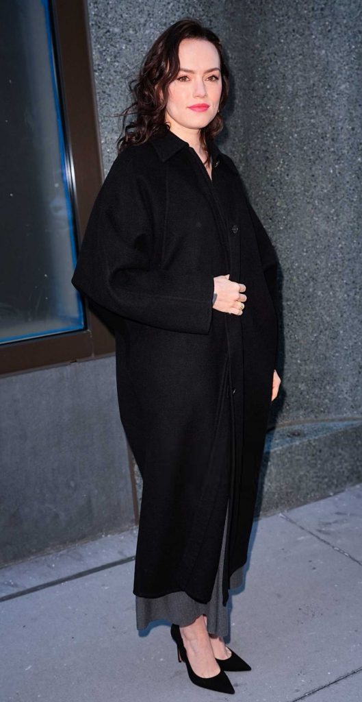 Daisy Ridley in a Black Coat