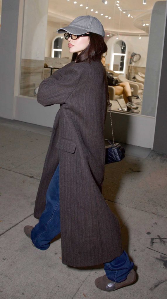 Dove Cameron in a Brown Coat