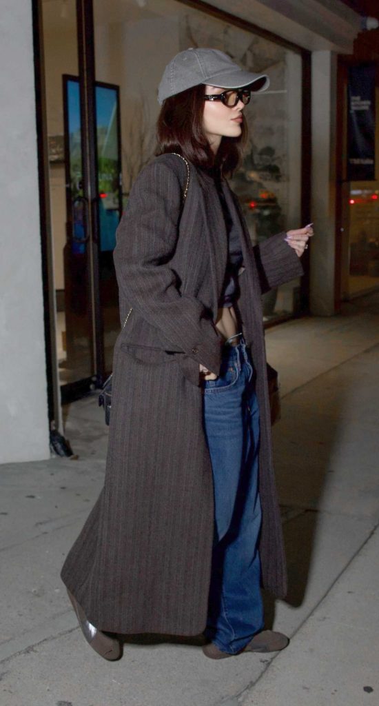 Dove Cameron in a Brown Coat