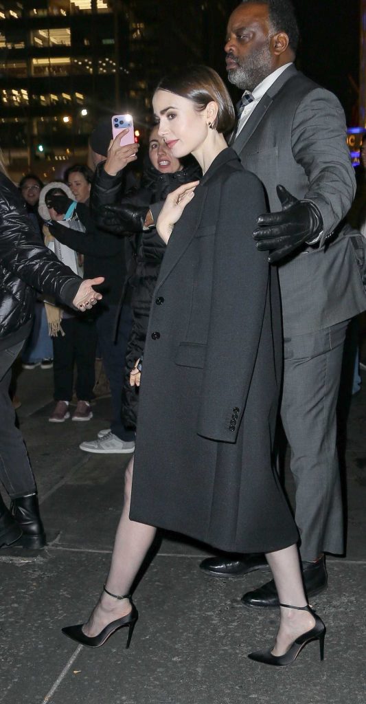 Lily Collins in a Black Coat
