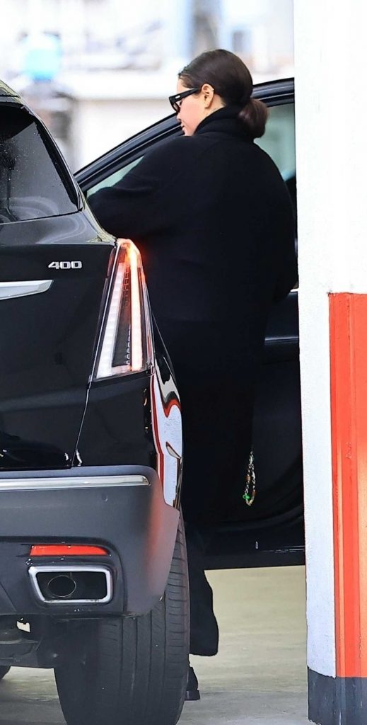 Selena Gomez in a Black Coat