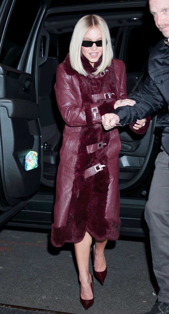 Sydney Sweeney in a Burgundy Leather Coat
