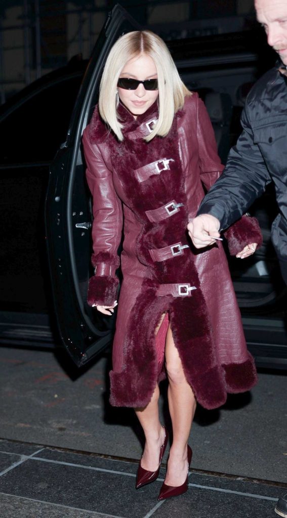 Sydney Sweeney in a Burgundy Leather Coat