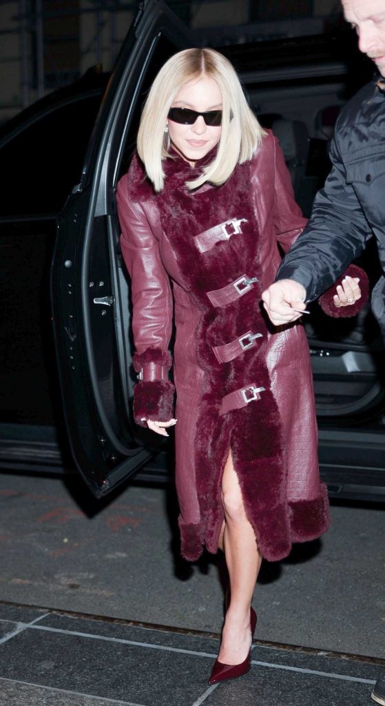 Sydney Sweeney in a Burgundy Leather Coat