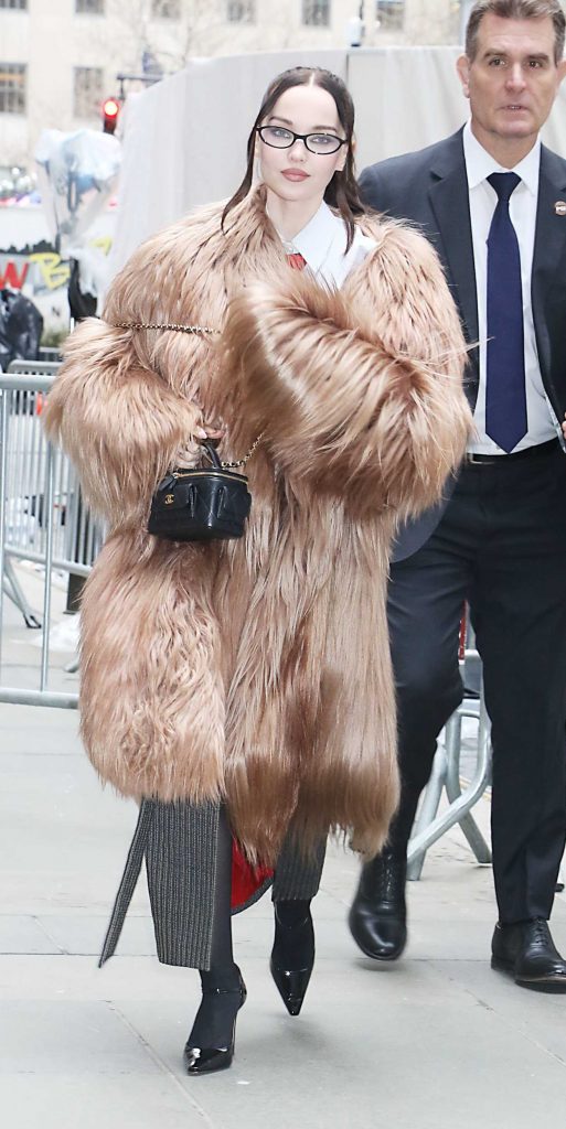 Dove Cameron in a Beige Fur Coat