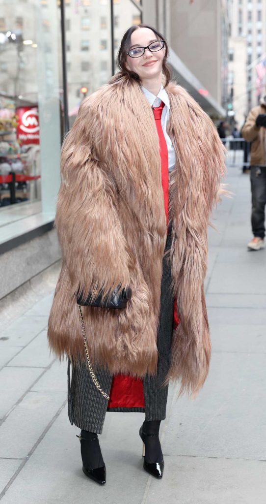 Dove Cameron in a Beige Fur Coat