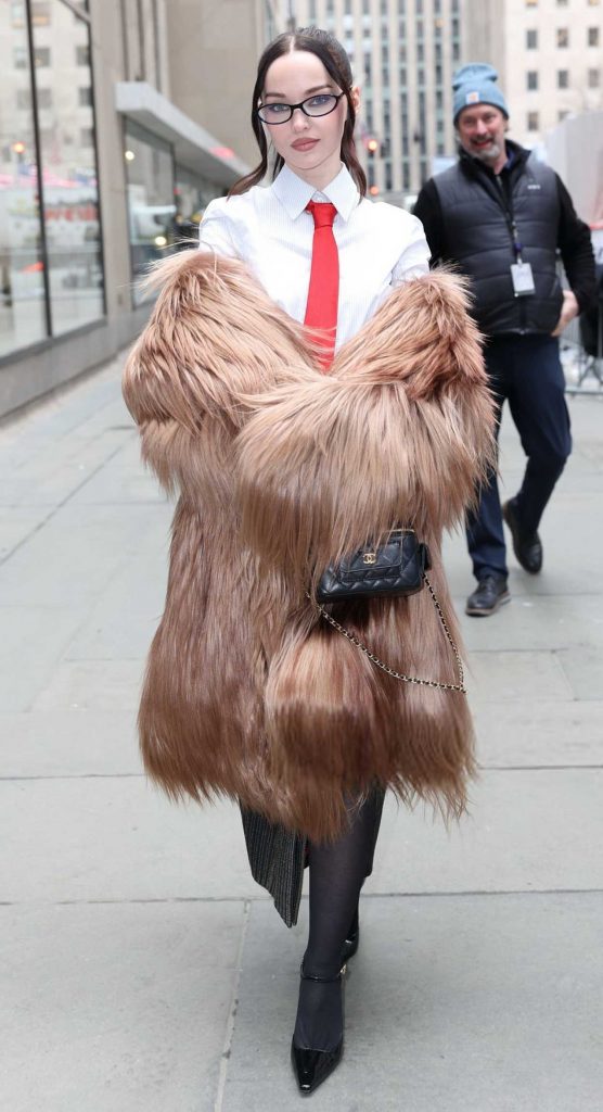 Dove Cameron in a Beige Fur Coat