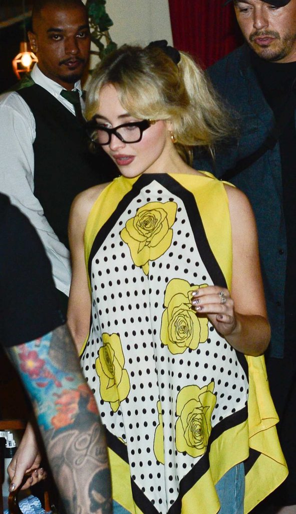 Sabrina Carpenter in a Blue Ripped Jeans