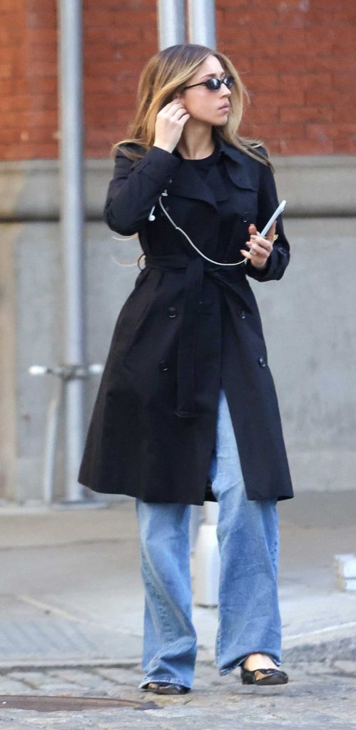 Tate McRae in a Black Trench Coat