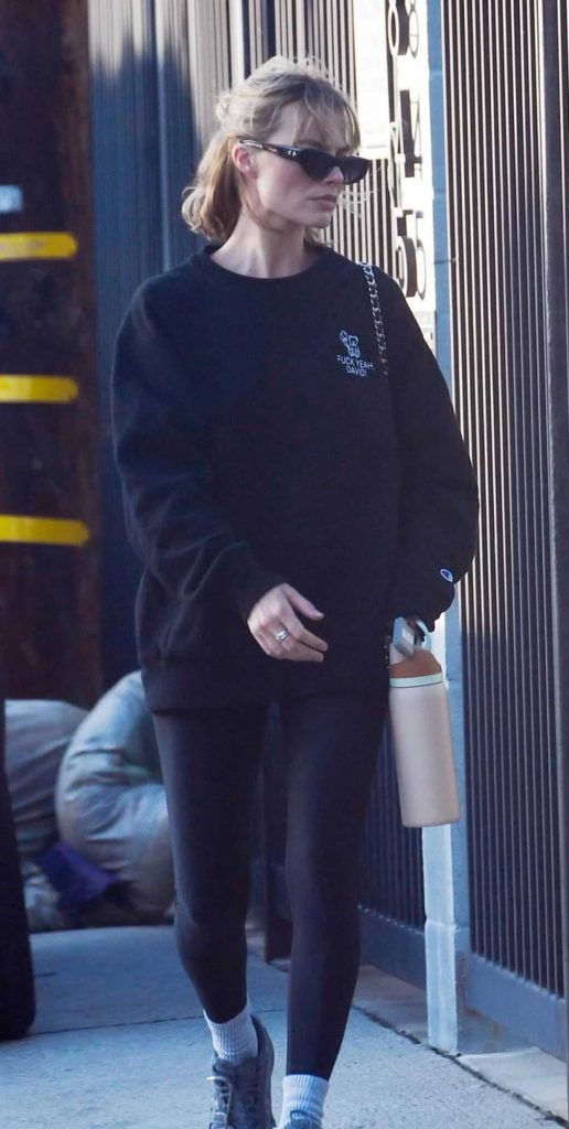 Margot Robbie in a Black Sweatshirt