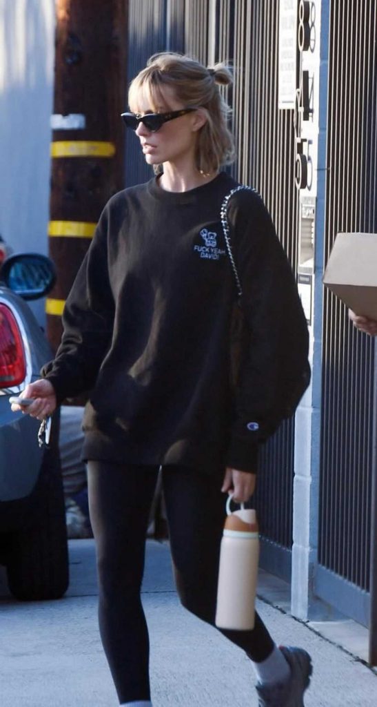 Margot Robbie in a Black Sweatshirt