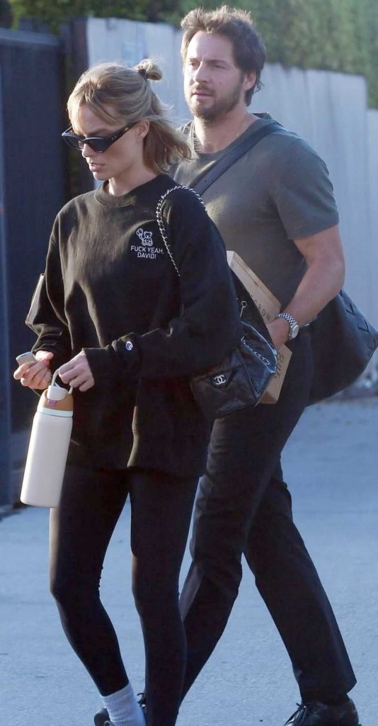 Margot Robbie in a Black Sweatshirt