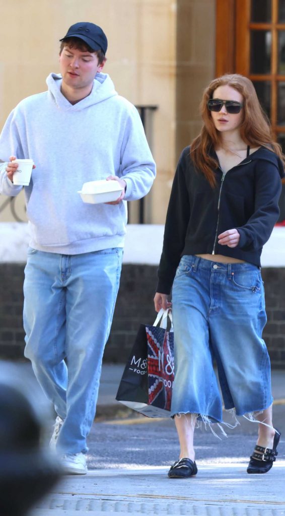Sadie Sink in a Black Track Jacket