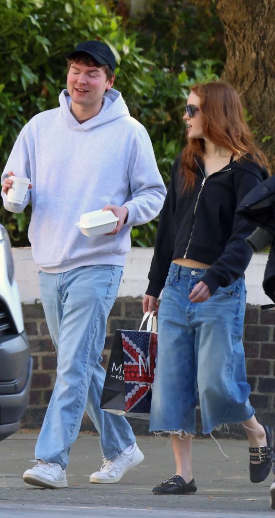 Sadie Sink in a Black Track Jacket