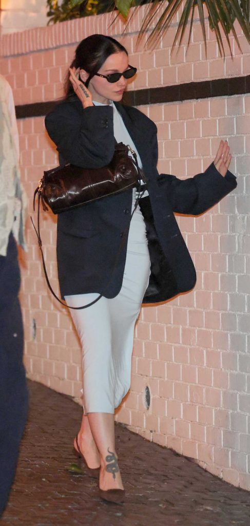 Dove Cameron in a Navy Blazer