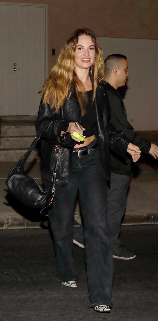 Lily James in a Black Jacket