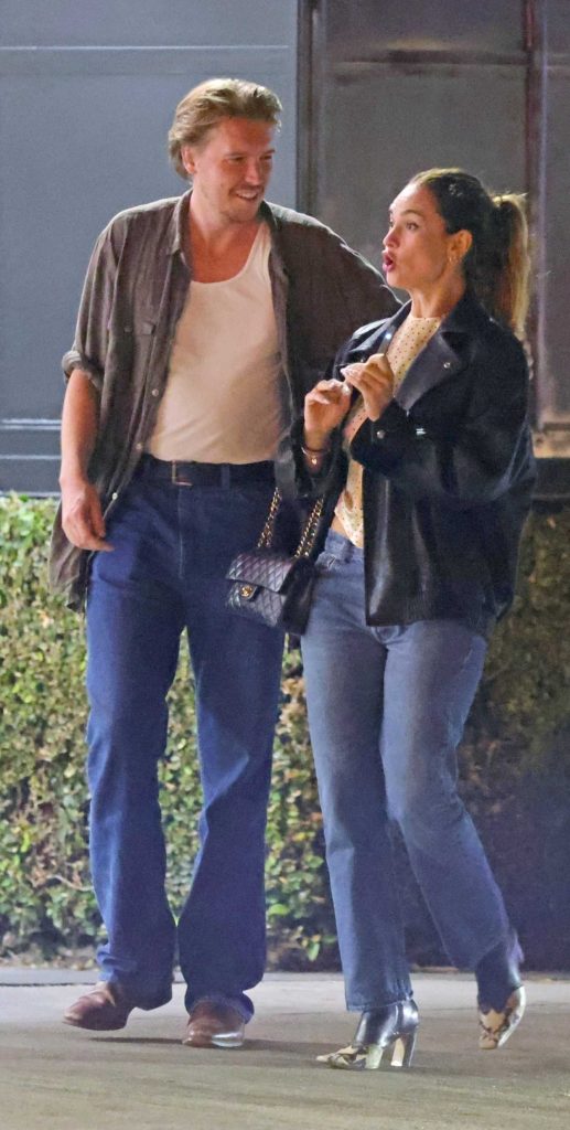 Lily James in a Black Leather Jacket