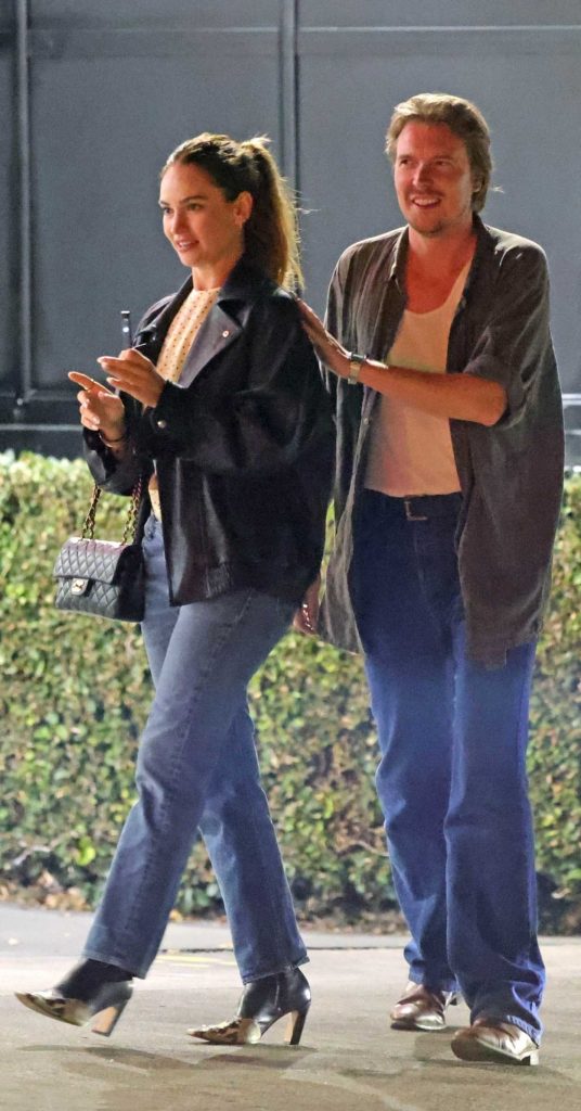Lily James in a Black Leather Jacket