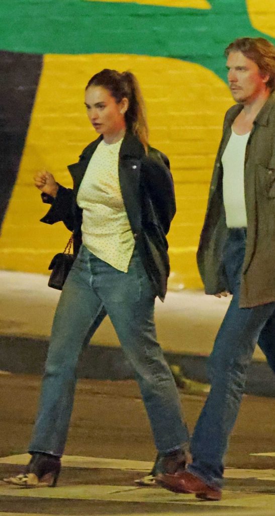 Lily James in a Black Leather Jacket