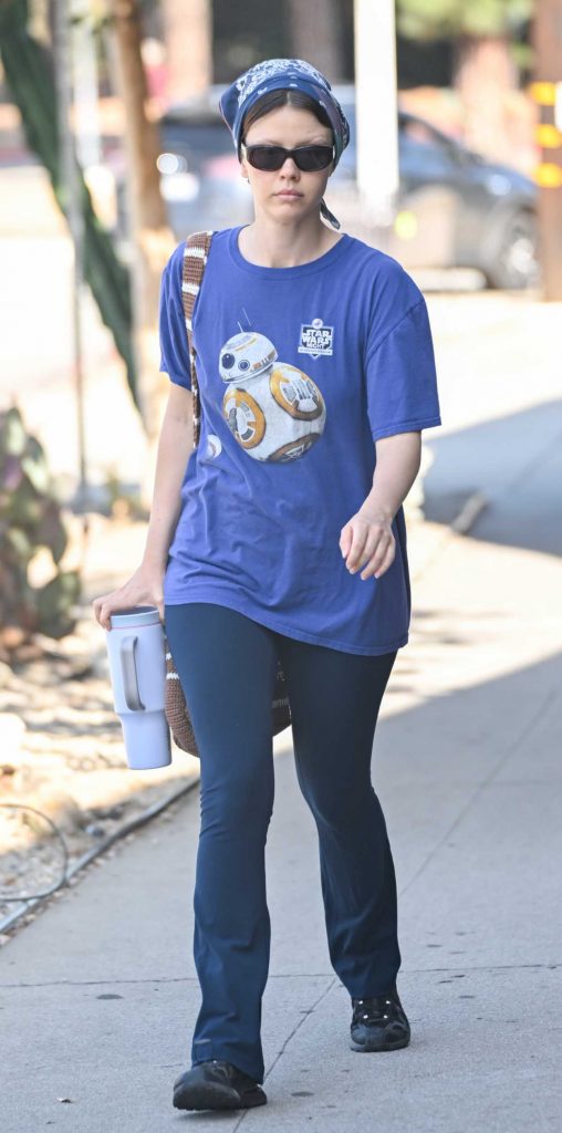 Mia Goth in a Blue Tee