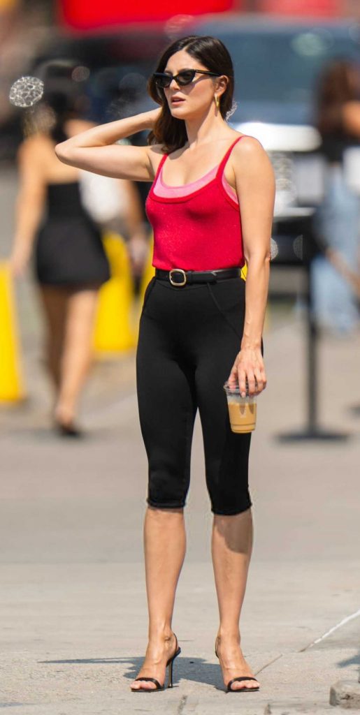 Monica Barbaro in a Red Top