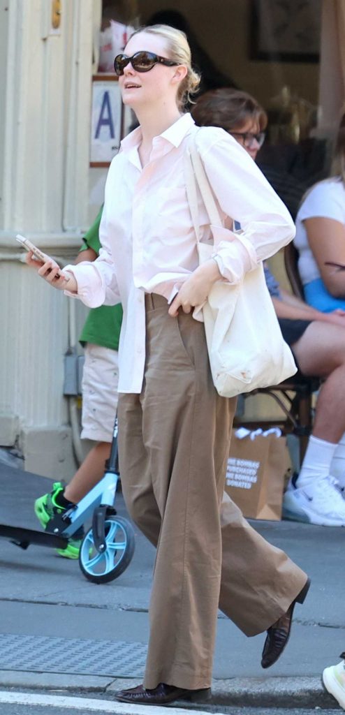 Elle Fanning in a Pink Shirt