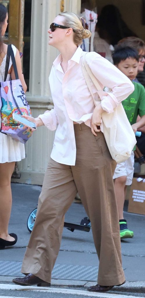 Elle Fanning in a Pink Shirt