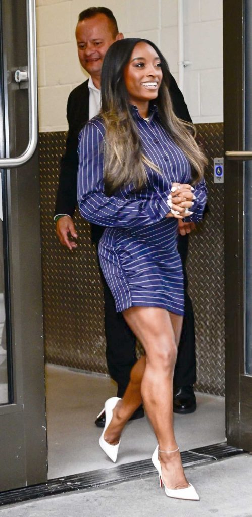 Simone Biles in a Blue Striped Ensemble