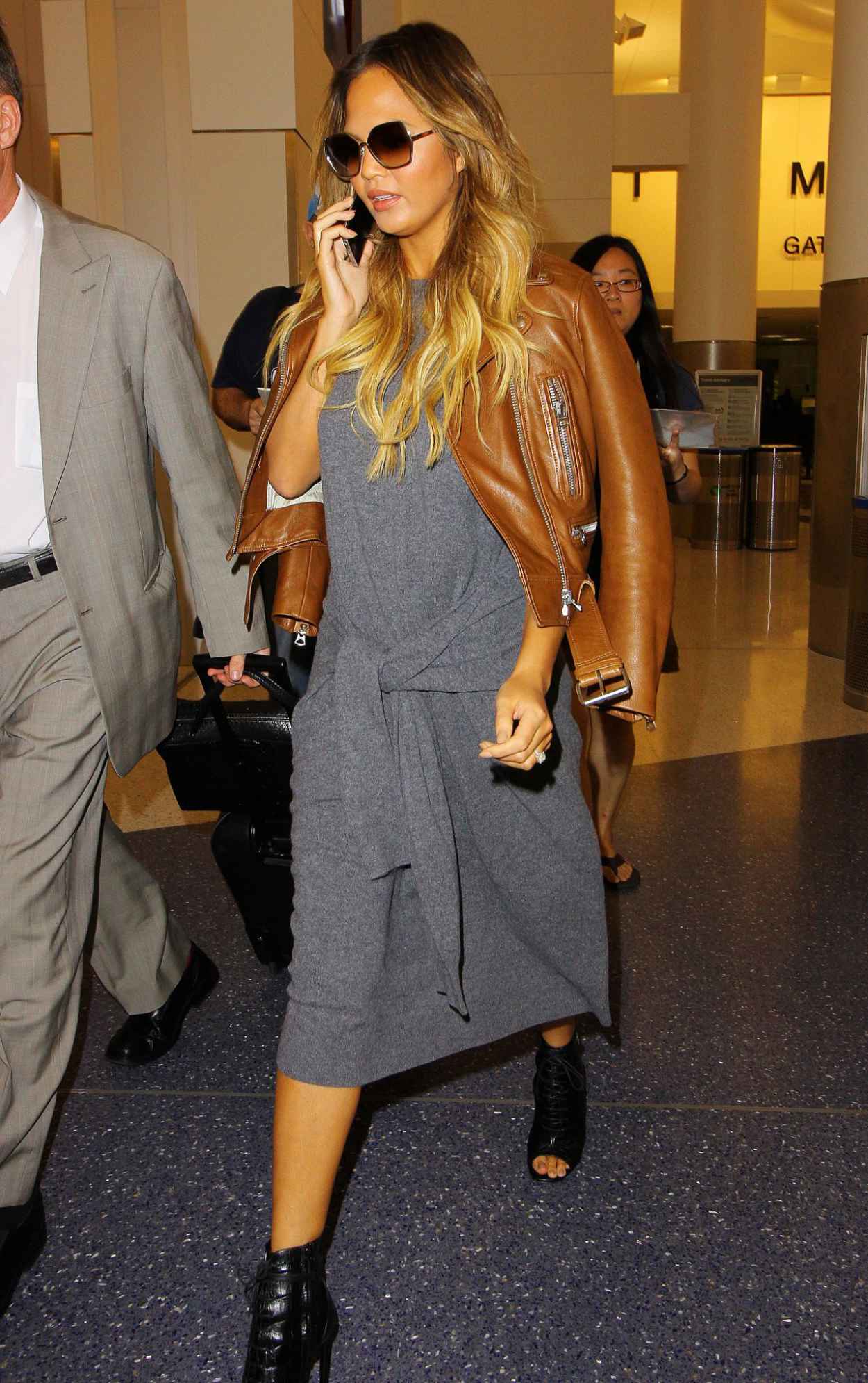 Chrissy Teigen at LAX Airport, August 2015 – celebsla.com