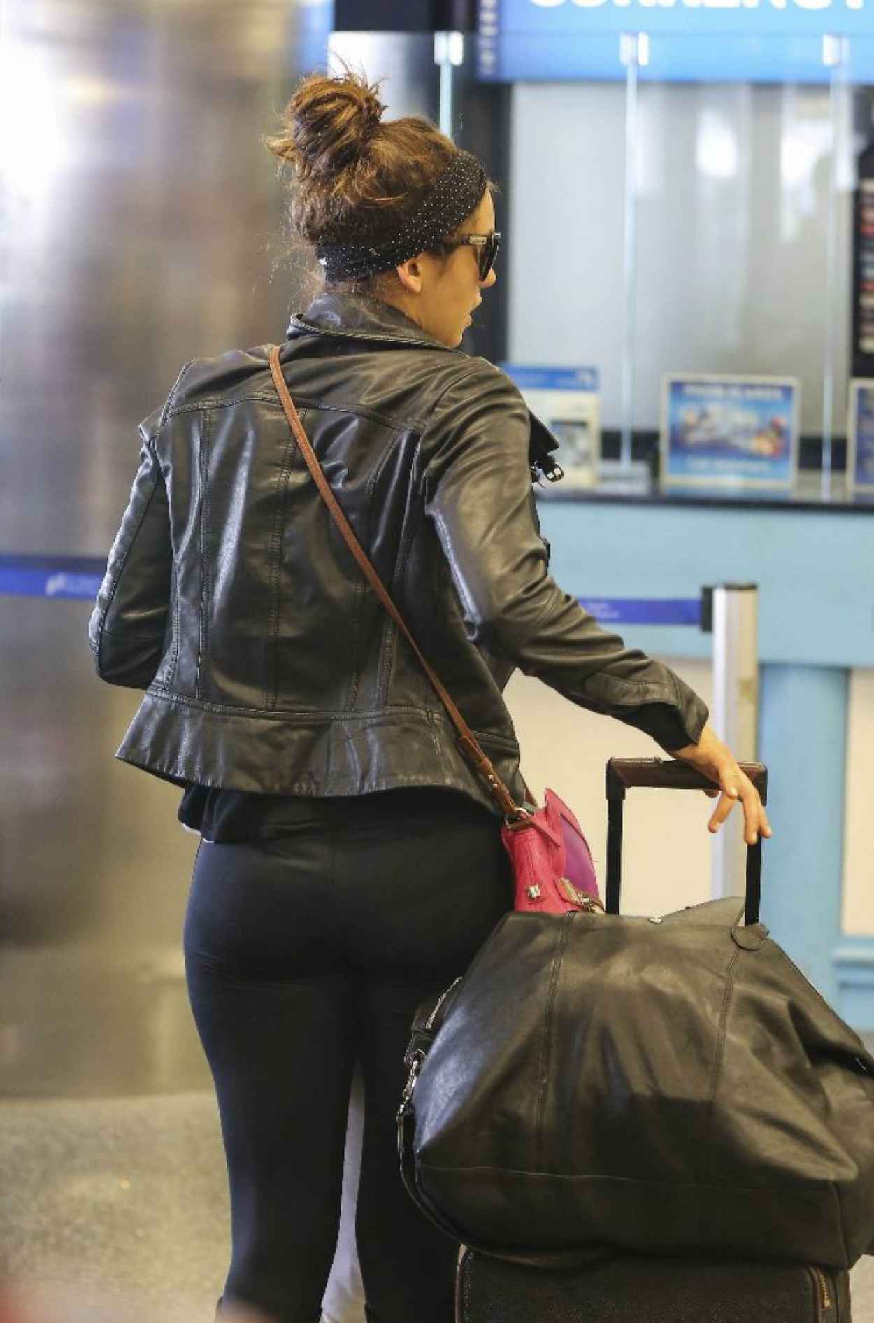 Nina Dobrev - Booty in Tights at LAX Airport - March 2015.