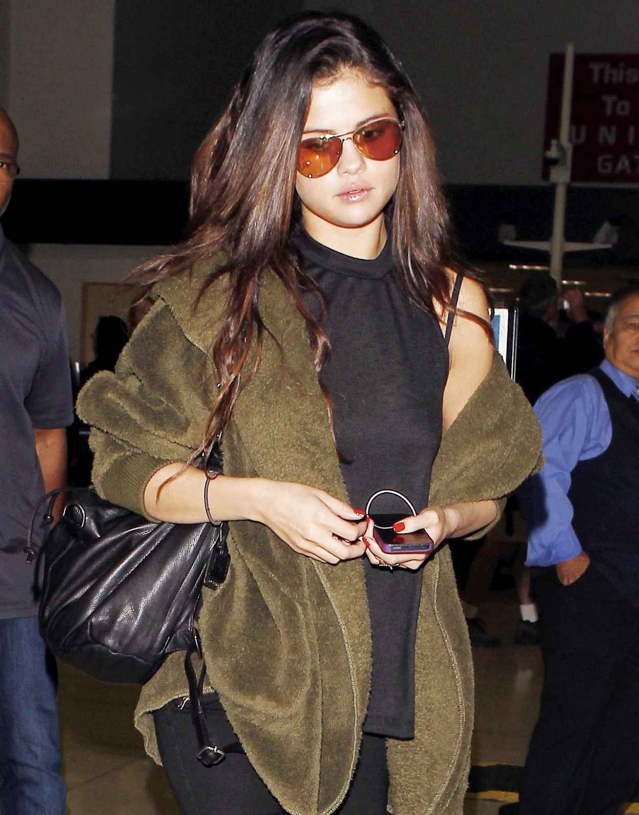 Selena Gomez – Leaving LAX Airport in Los Angeles – February 2015 ...